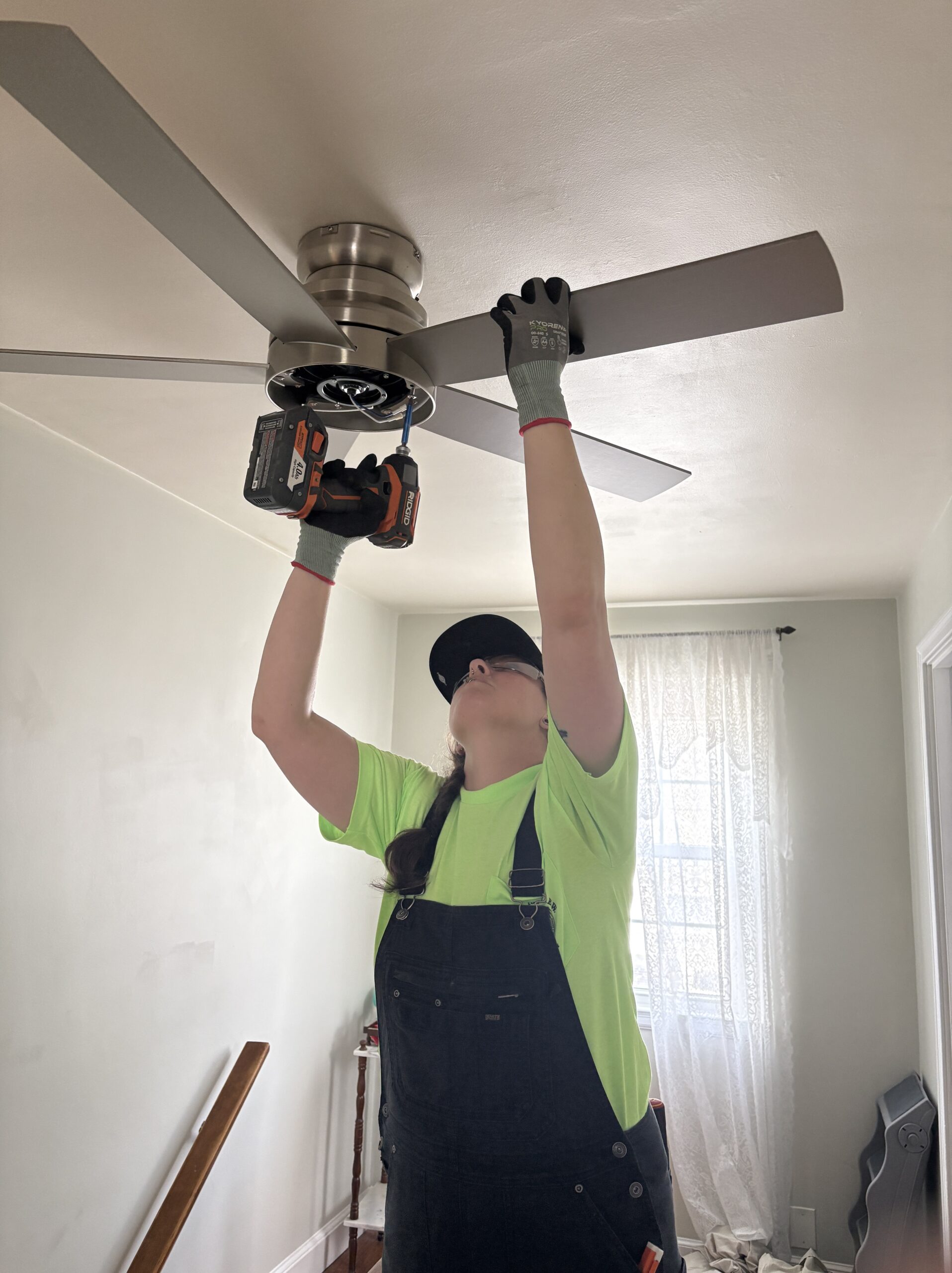 Photo of Rose Electric Co installing a ceiling fan